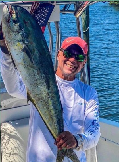 Man holding a Mahi Fish