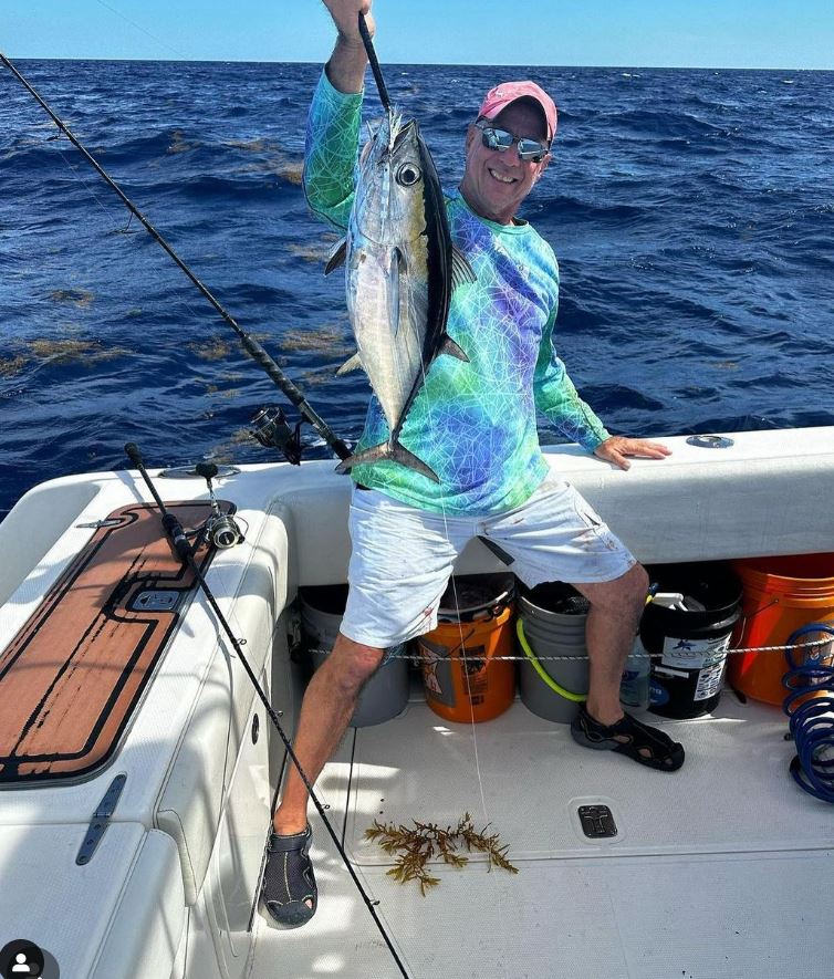 Man holding Tuna fish on the boat