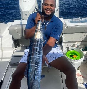 Man holding wahoo fish